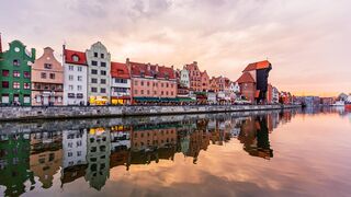 Gdansk skyline at sunset seen at the waterfront of Motlawa river, Gdansk, Poland